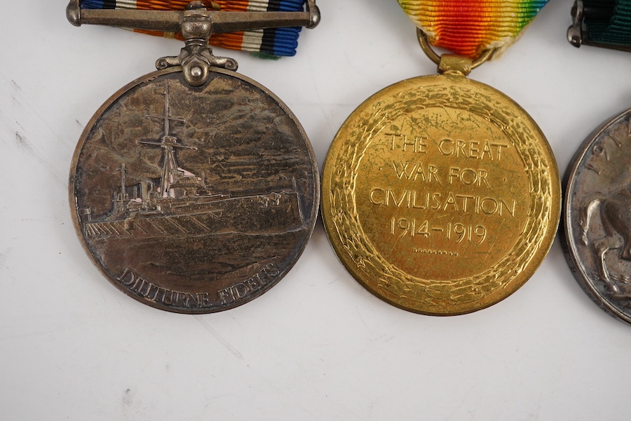 A First World War medal trio and Naval Reserve Long Service medal awarded to R.E.A. Lawrence ENGN RNR. Condition - fair.